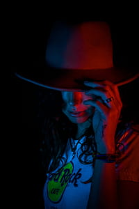 Woman in Gray Hat and White Crew-neck Shirt thumbnail
