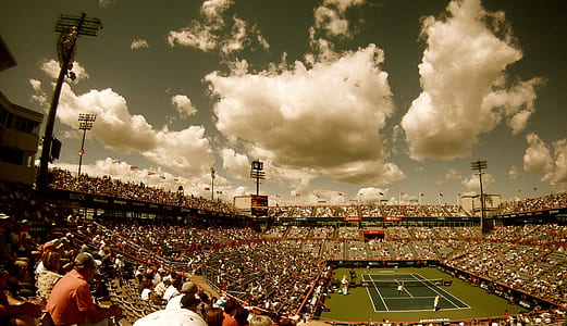 time lapse photography of clouds over tennis stadium thumbnail