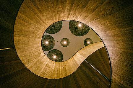 Lights above a spiral staircase in a designer hotel in London, England thumbnail