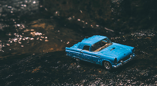 blue muscle car die-cast covered of water thumbnail