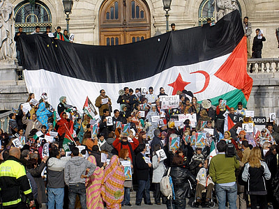 people in front of large flag thumbnail
