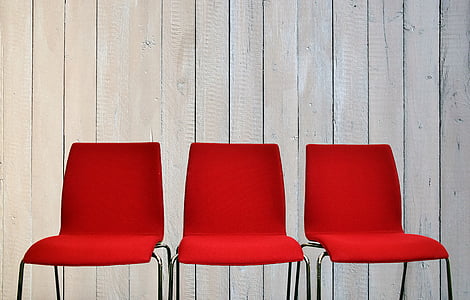 three red-and-gray metal chairs thumbnail