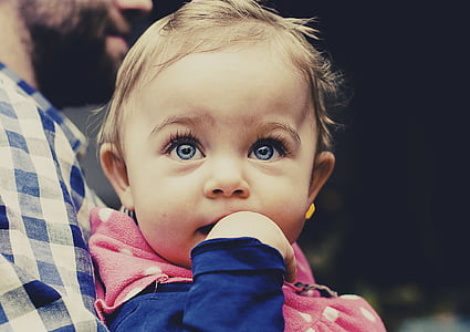 child wearing pink jacket thumbnail