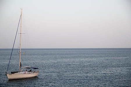 White Yacht on Ocean during Cloufy Day thumbnail