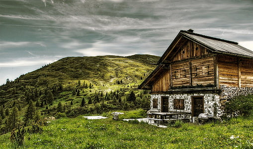 brown wooden house on mountain thumbnail