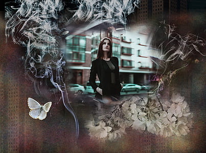 woman in black top standing beside road thumbnail