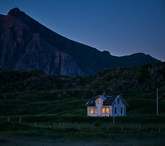 white and black house and mountain at night time thumbnail