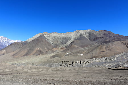 gray and brown mountain under blue sky thumbnail