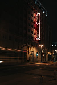 building with neon signage during night thumbnail