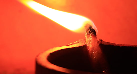 lit black candle thumbnail