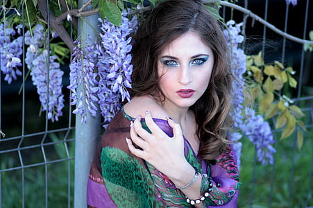 women wearing green and multicolored dress thumbnail