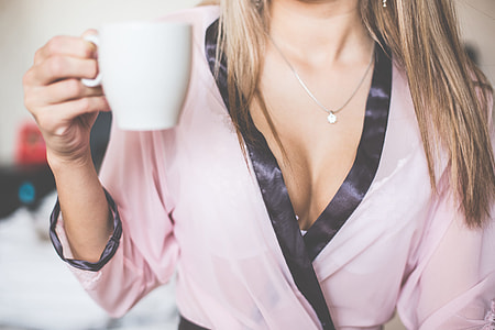 Wonderful Girl in Silk Nightgown Enjoying Morning Tea thumbnail