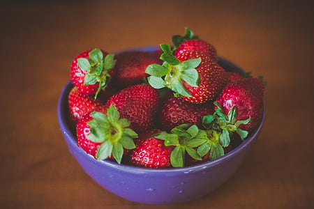 purple ceramic bowl filled with strawberry thumbnail