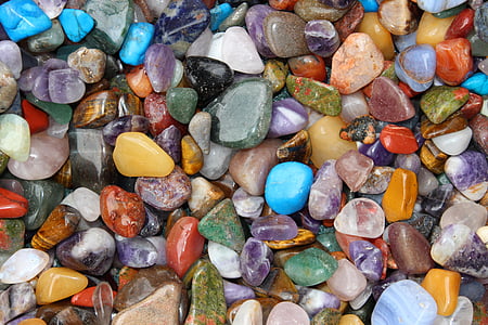 scattered assorted color pebbles thumbnail