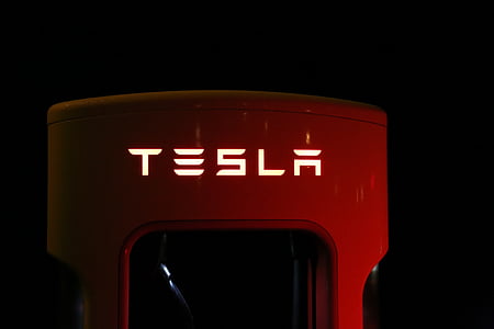 close-up photography of red Tesla vehicle fob thumbnail