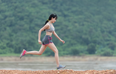 woman running near body of water thumbnail
