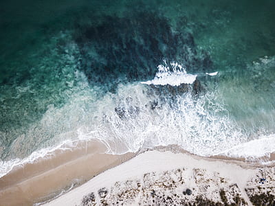 sea waves on white and brown shore thumbnail