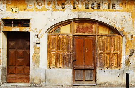 gray concrete house with closed doors thumbnail