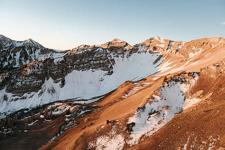 brown mountain under blue sky thumbnail