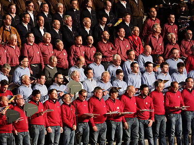 crowd of men standing while holding book thumbnail
