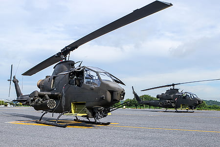 two gray helicopter on airport during daytime thumbnail