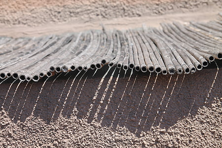 gray tube lot on sand thumbnail