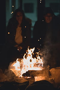 man and woman sitting in front of von fire thumbnail
