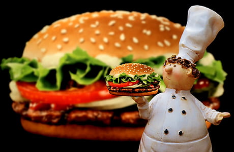chef carrying burger ceramic figurine thumbnail