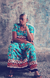 woman sitting on plastic chair thumbnail