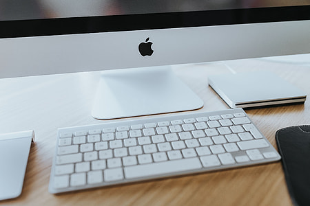White Apple iMac computer with elephant mousepad thumbnail