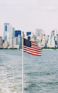 flag of USA near body of water thumbnail