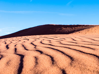 sand field under clear blue sky thumbnail