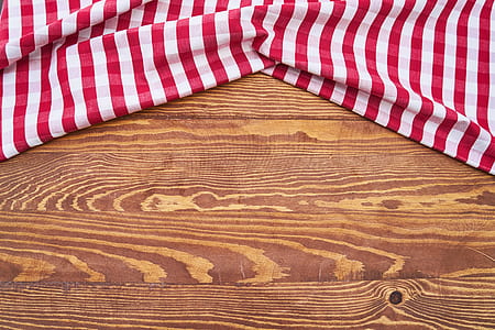 white and red striped textile on brown wooden panel thumbnail