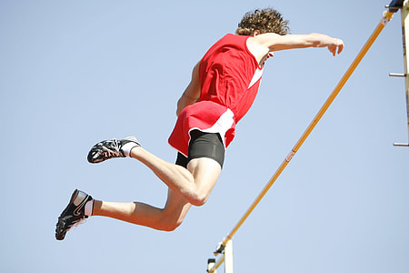 man jumping over yellow pole thumbnail