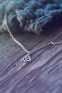 silver-colored celtic knot pendant necklace thumbnail