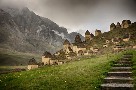 houses near rocky mountain during dayrime thumbnail