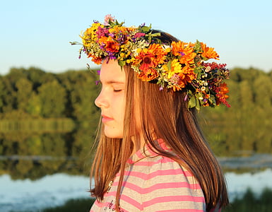 girl wearing assorted-color flower headband thumbnail
