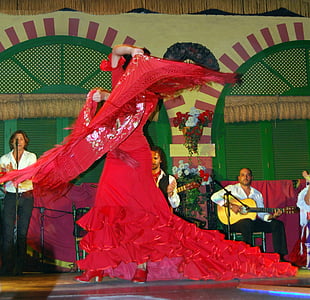 woman wearing red flare dress while dancing thumbnail