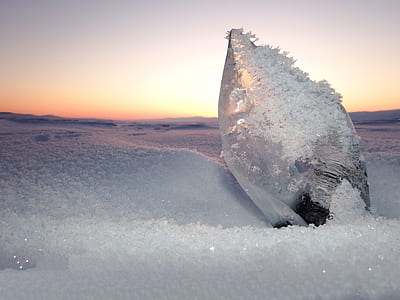 gray rock covered with snow thumbnail