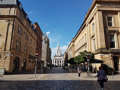 people walking on road near building at daytime thumbnail