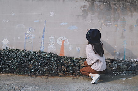 woman about to draw on concrete wall thumbnail