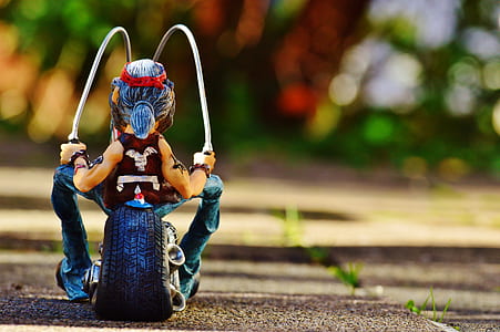 worm view photography of man riding chopper motorcycle miniature thumbnail