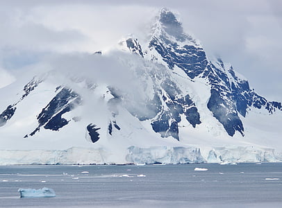 gray icy mountain covered with clouds thumbnail