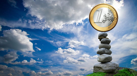 stack on gray stone on top green grass thumbnail