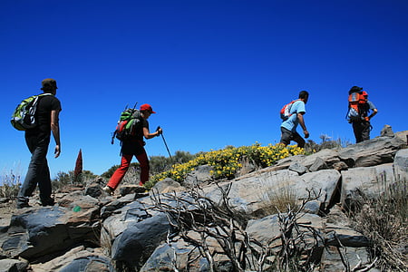 five man hiking on gray mountain thumbnail
