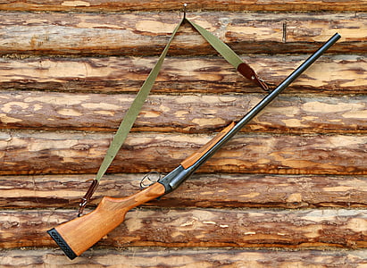 brown and black rifle thumbnail