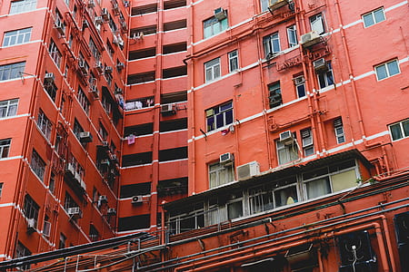 architectural photography of orange apartment-type building thumbnail