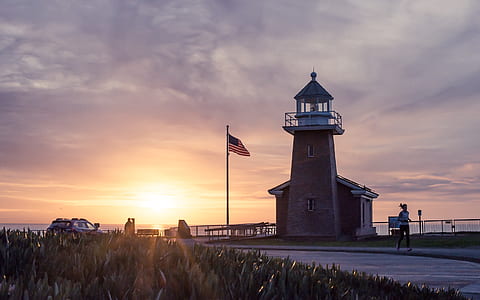 flag of United States of America on pole during golden hour thumbnail