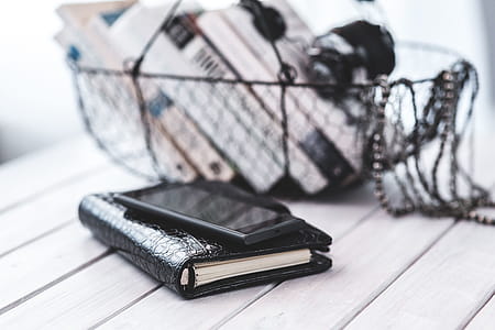 Black smartphone and headphones with various items thumbnail