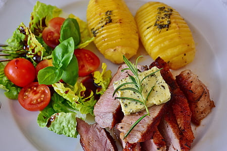 grilled meat ; yellow sliced cheese . two yellow slice pineapples on round white ceramic plate thumbnail